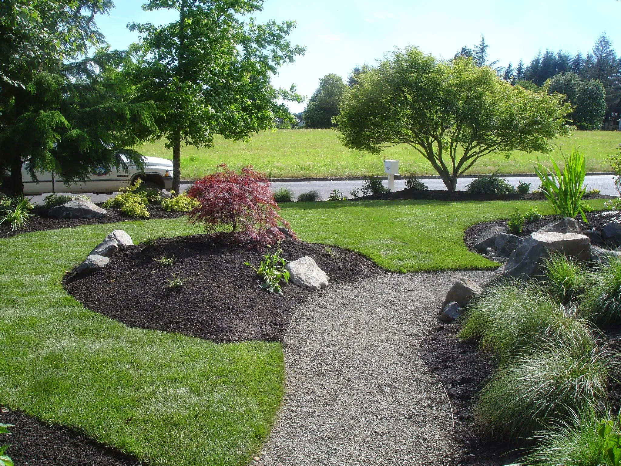Well-kept residential front yard maintained by Earthworks